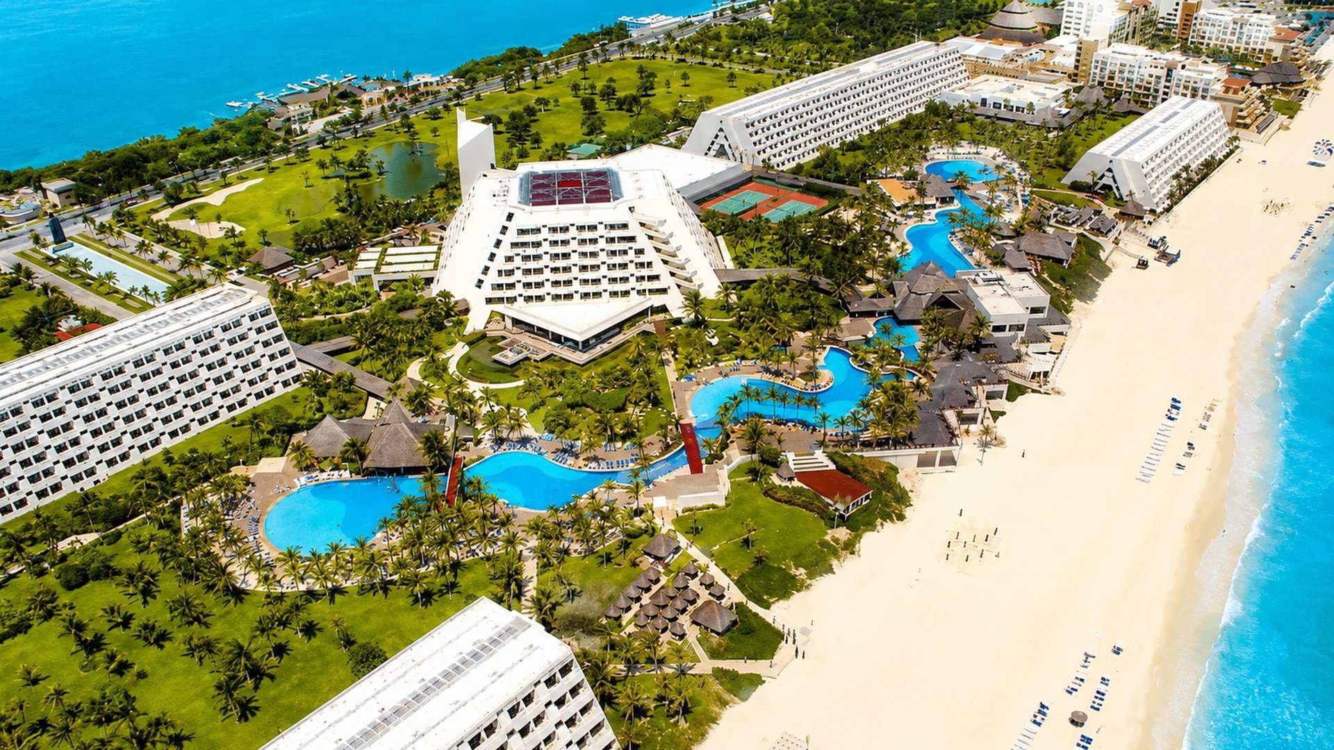Aerial view of an all-inclusive Cancun resort pool and beach