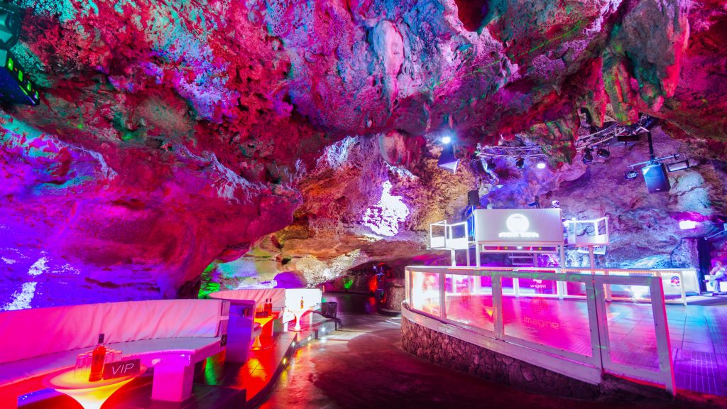a large cave filled with lots of colorful lights.